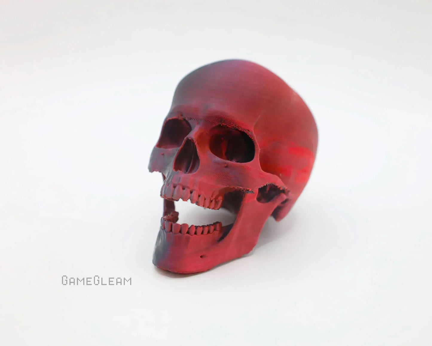 Handmade red human skull decor, resin display accessory on white background