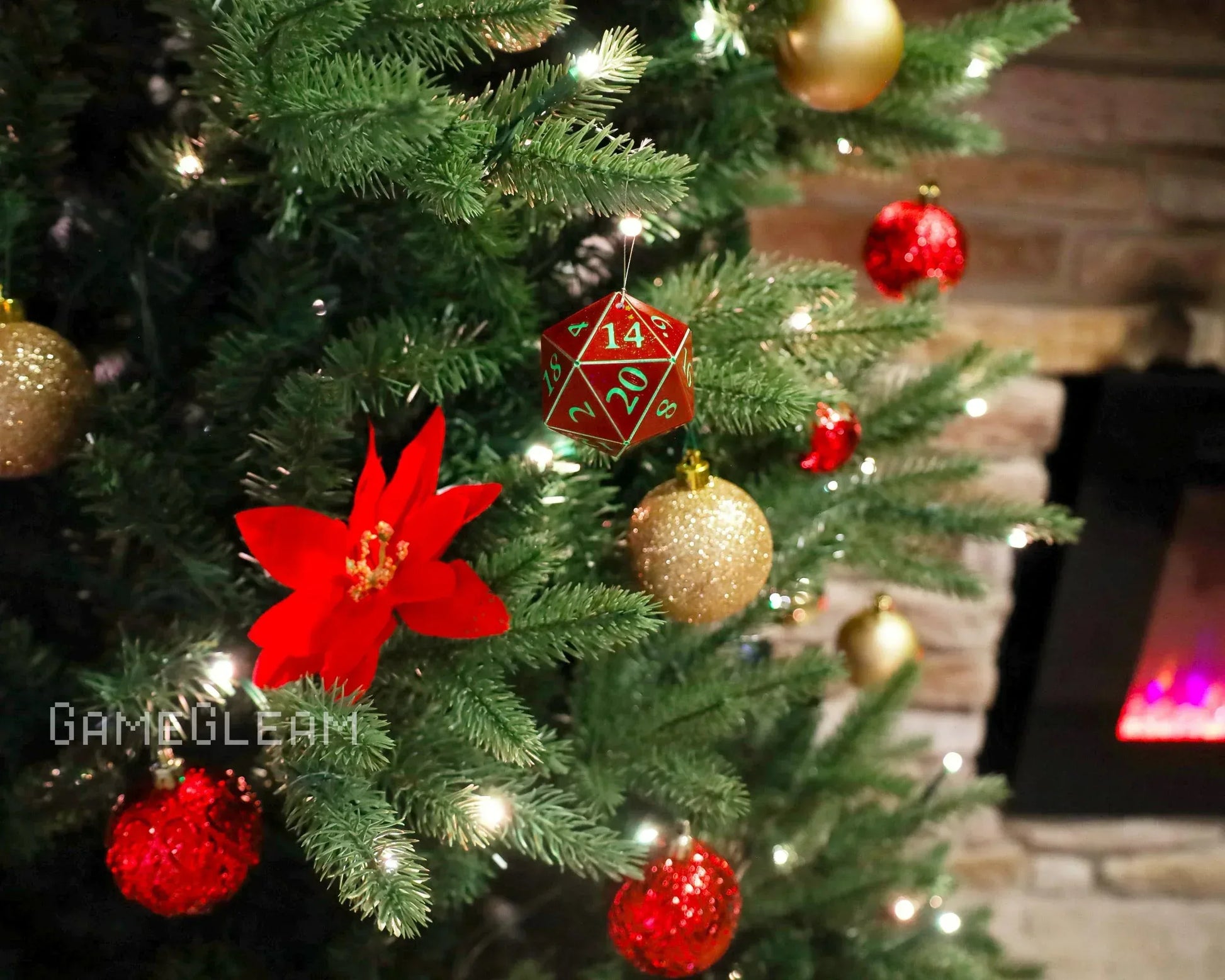 Red twenty-sided dice ornament hanging on a decorated Christmas tree with gold and red baubles.