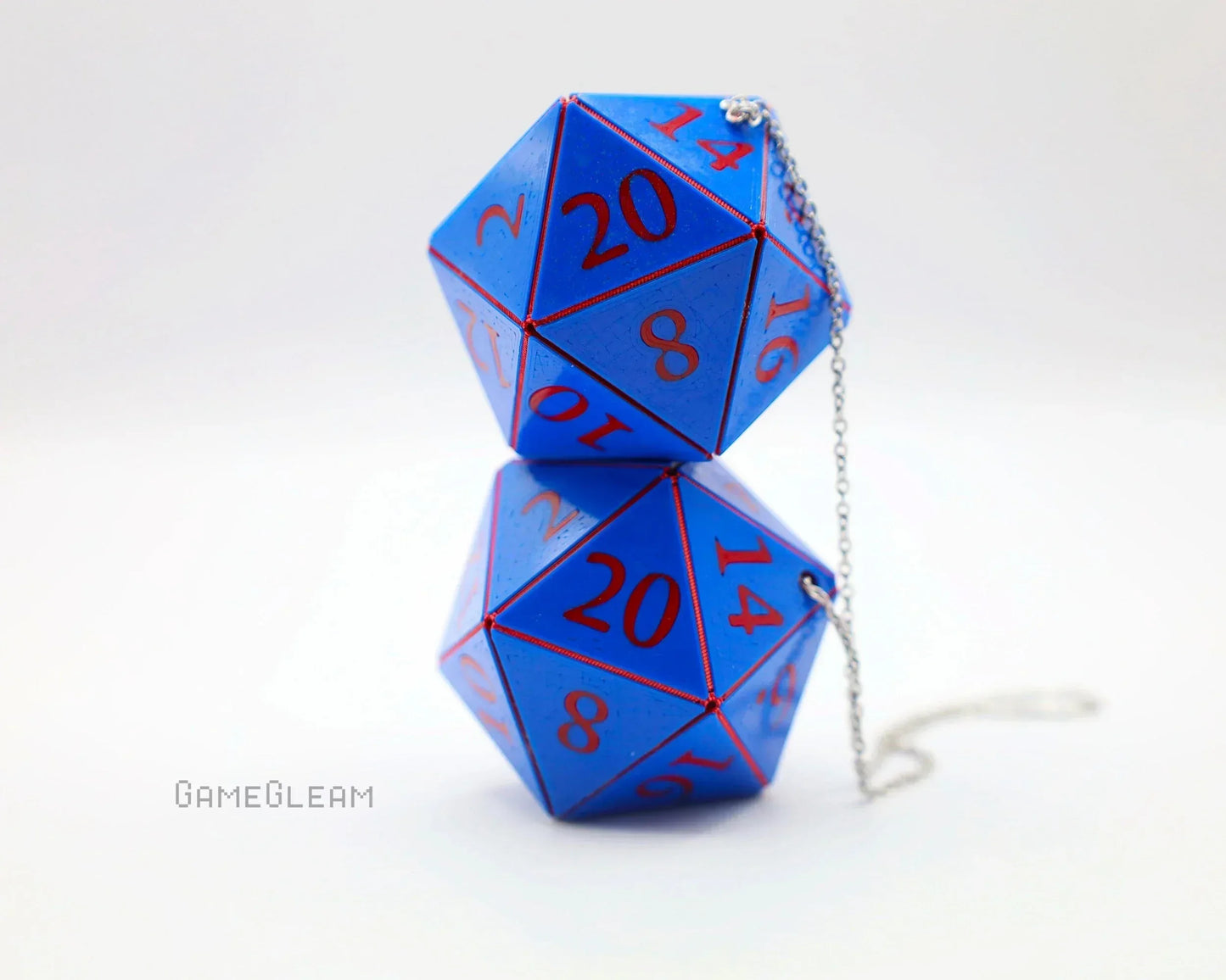 Blue twenty-sided dice car charm with red numbers and silver chain, on white background