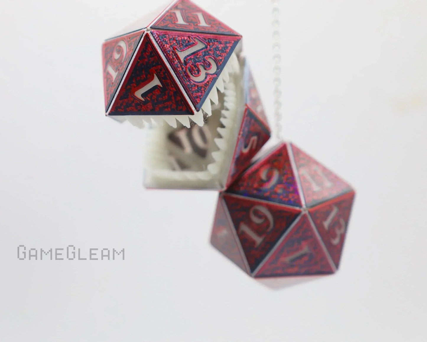 Red holographic 20-sided dice car charm with teeth, hanging on a chain, for RPG fans