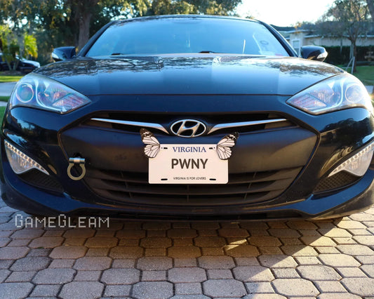 Black Hyundai car with custom Virginia license plate reading PWNY and butterfly stickers