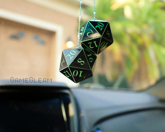 Holographic twenty-sided dice car charm with green numbers hanging from rearview mirror