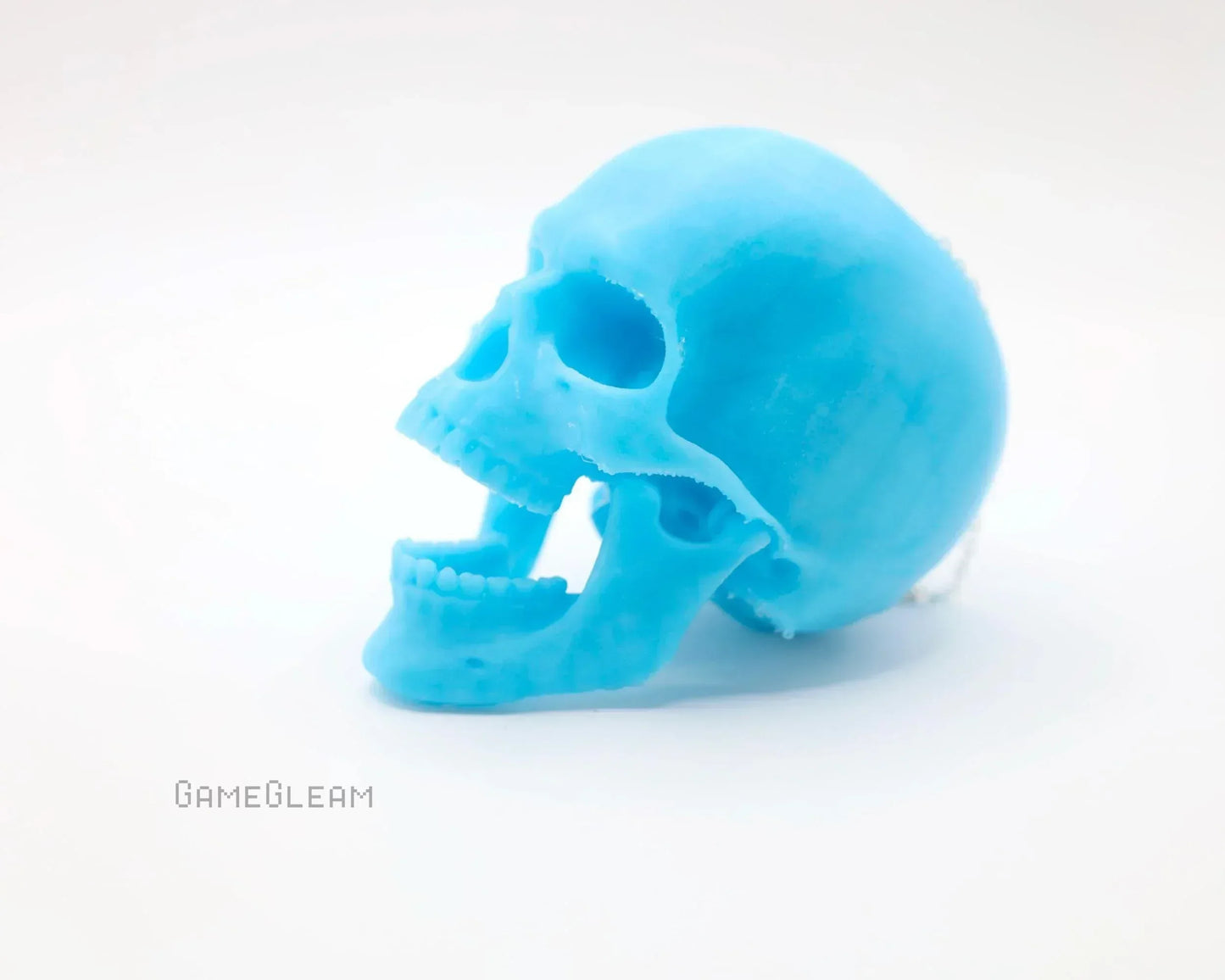 Handmade blue resin skull figurine for tabletop gaming or unique car decor