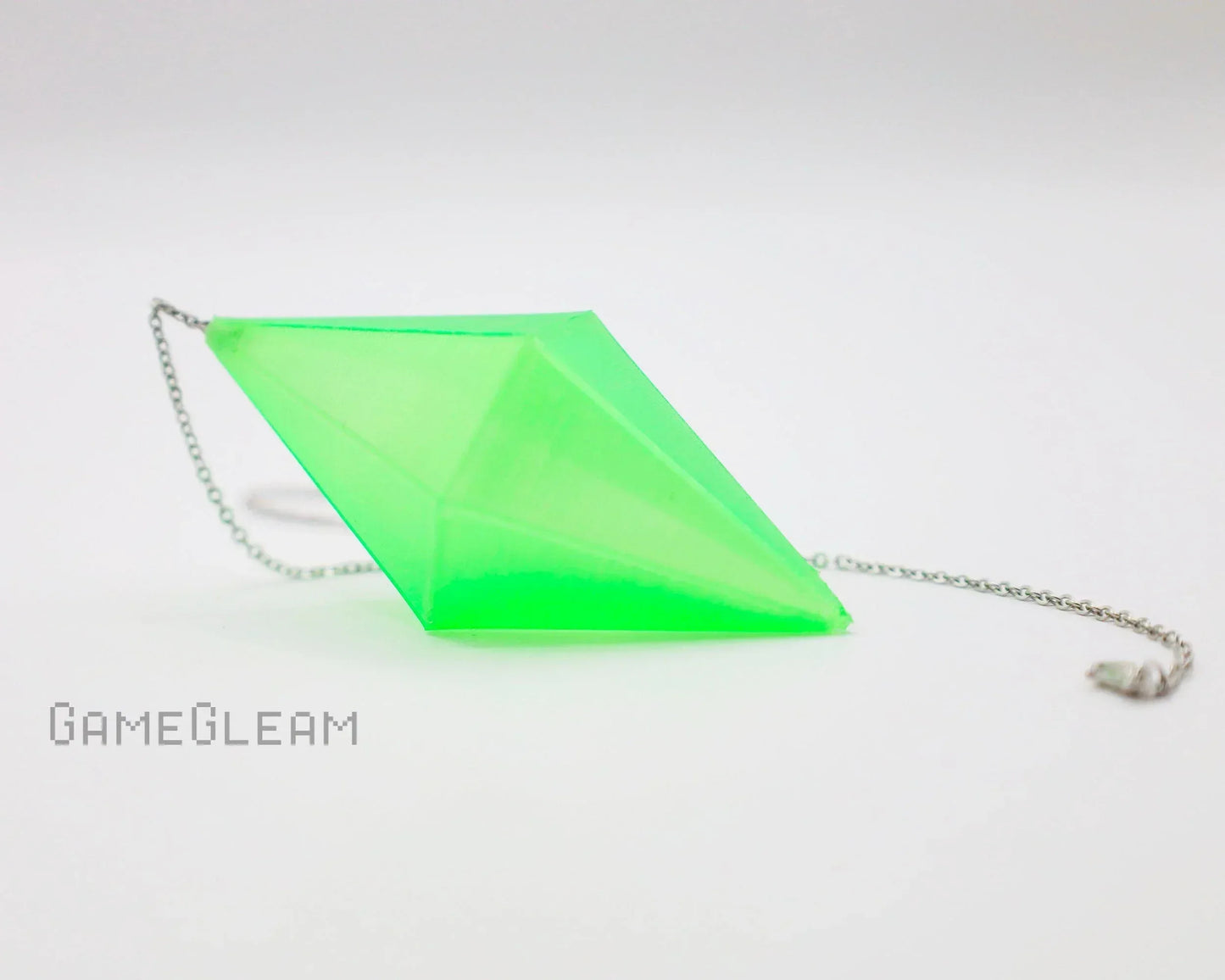 Handmade neon green geometric acrylic car charm with silver chain on white background