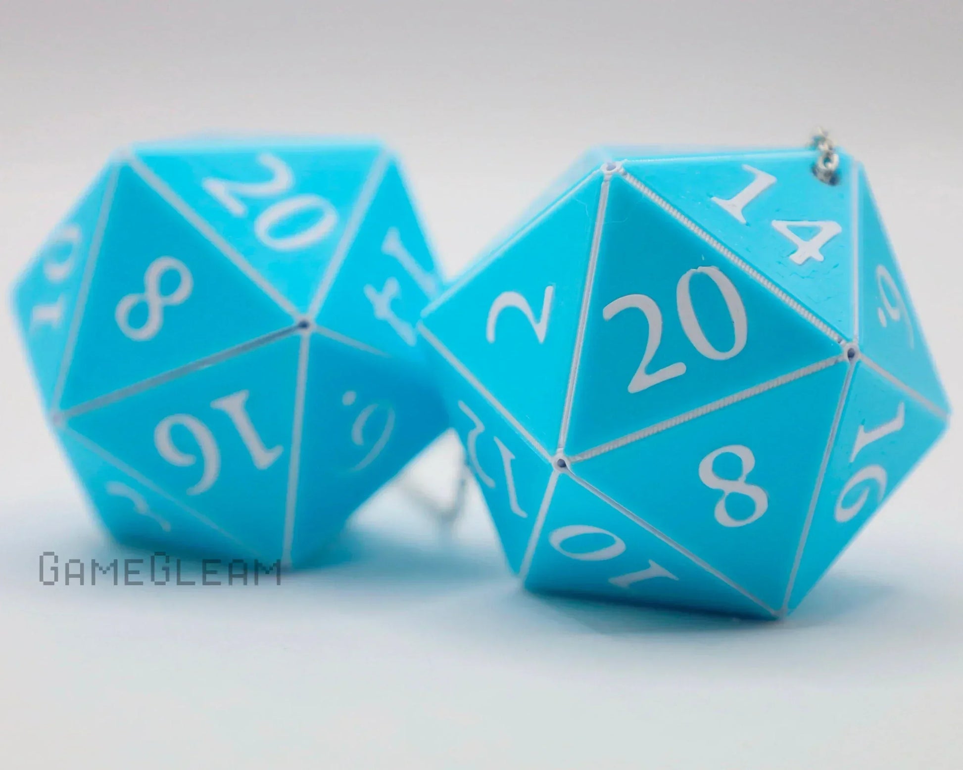 Blue 20-sided dice car charms with white numbers for tabletop RPG fans
