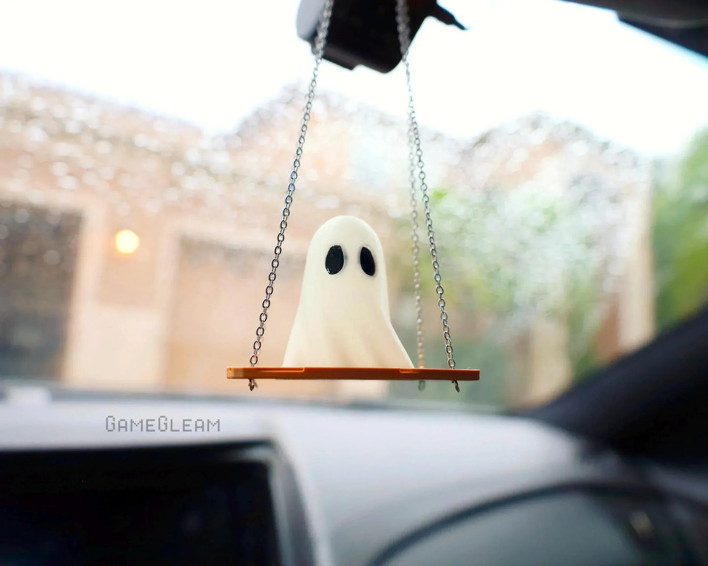 Ghost-shaped car charm on a swing hanging from rearview mirror, handmade gamer accessory