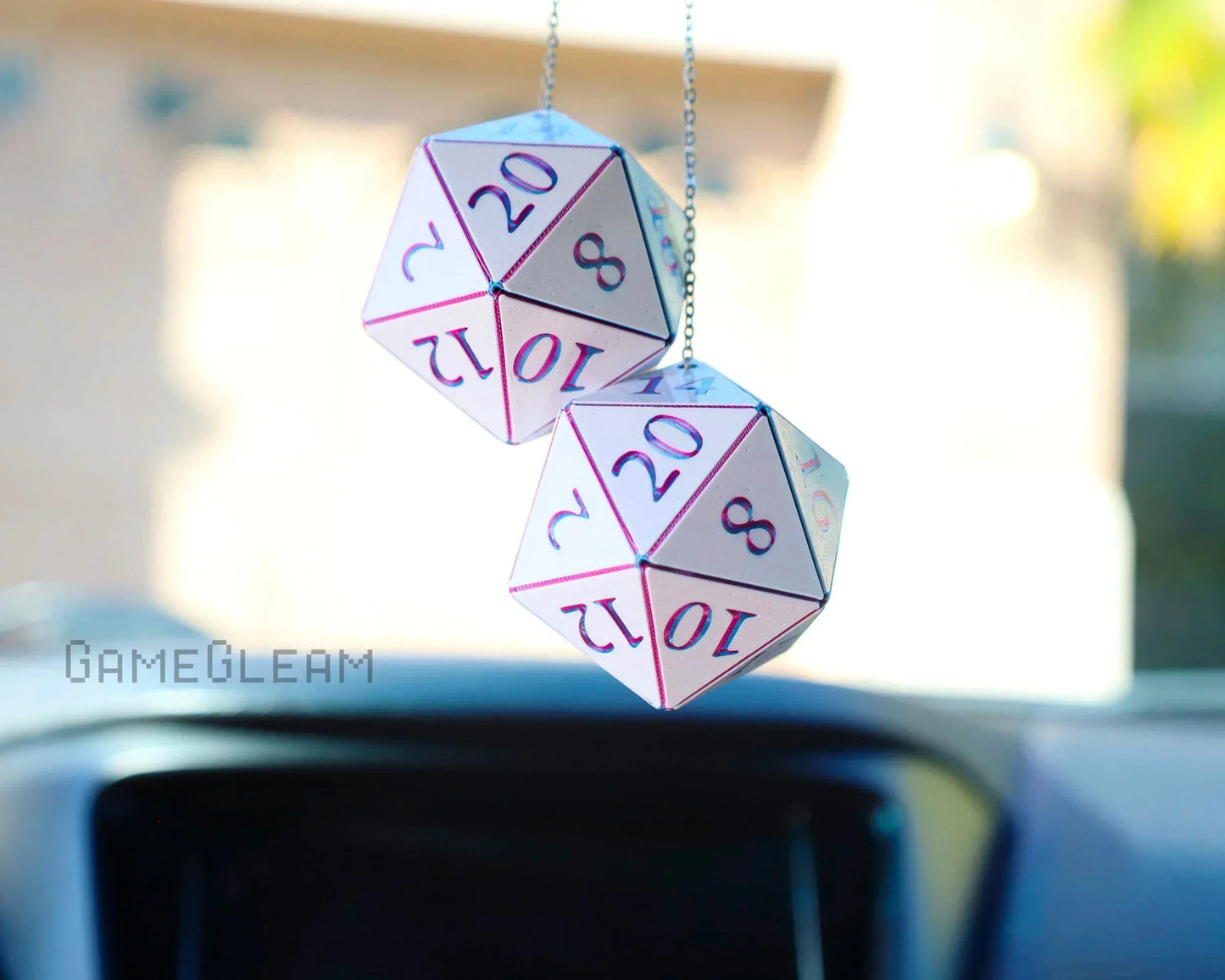Pink holographic twenty-sided dice car charm for tabletop RPG fans hanging on a chain