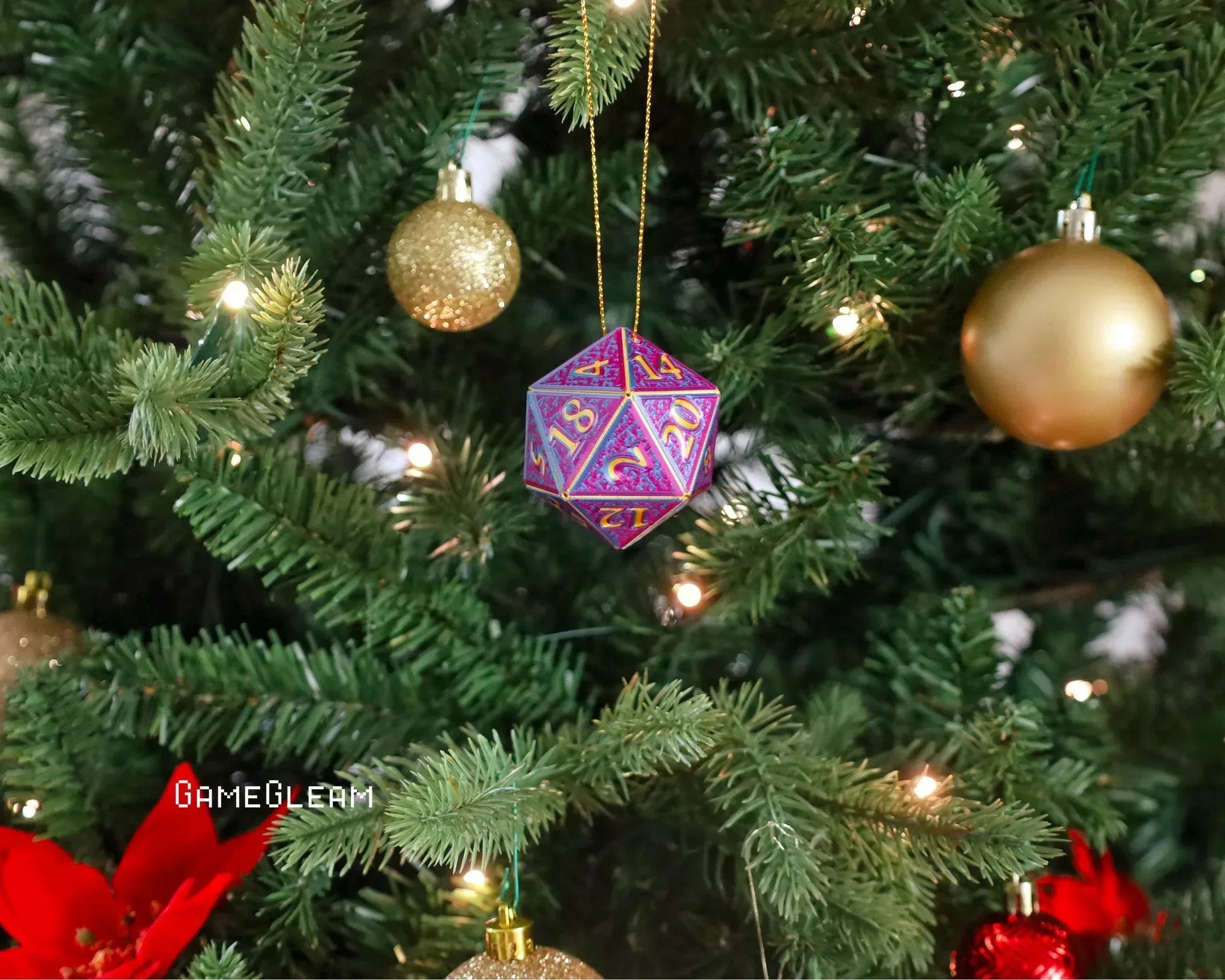 Purple and gold twenty-sided dice ornament hanging on a Christmas tree with festive baubles.