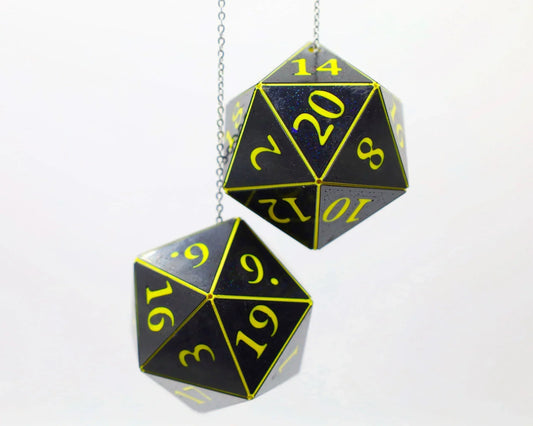 Holographic twenty-sided dice car charm with yellow numbers, hanging on a chain