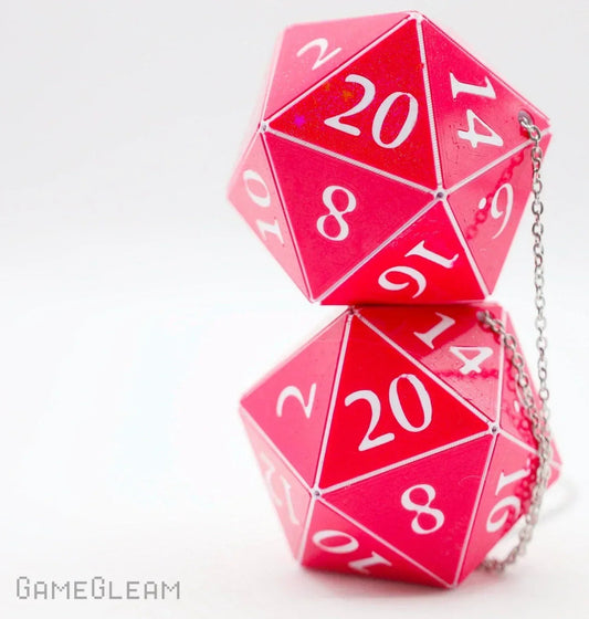 Pair of large pink twenty-sided dice with white numbers and a silver chain, ideal as gamer car charm.