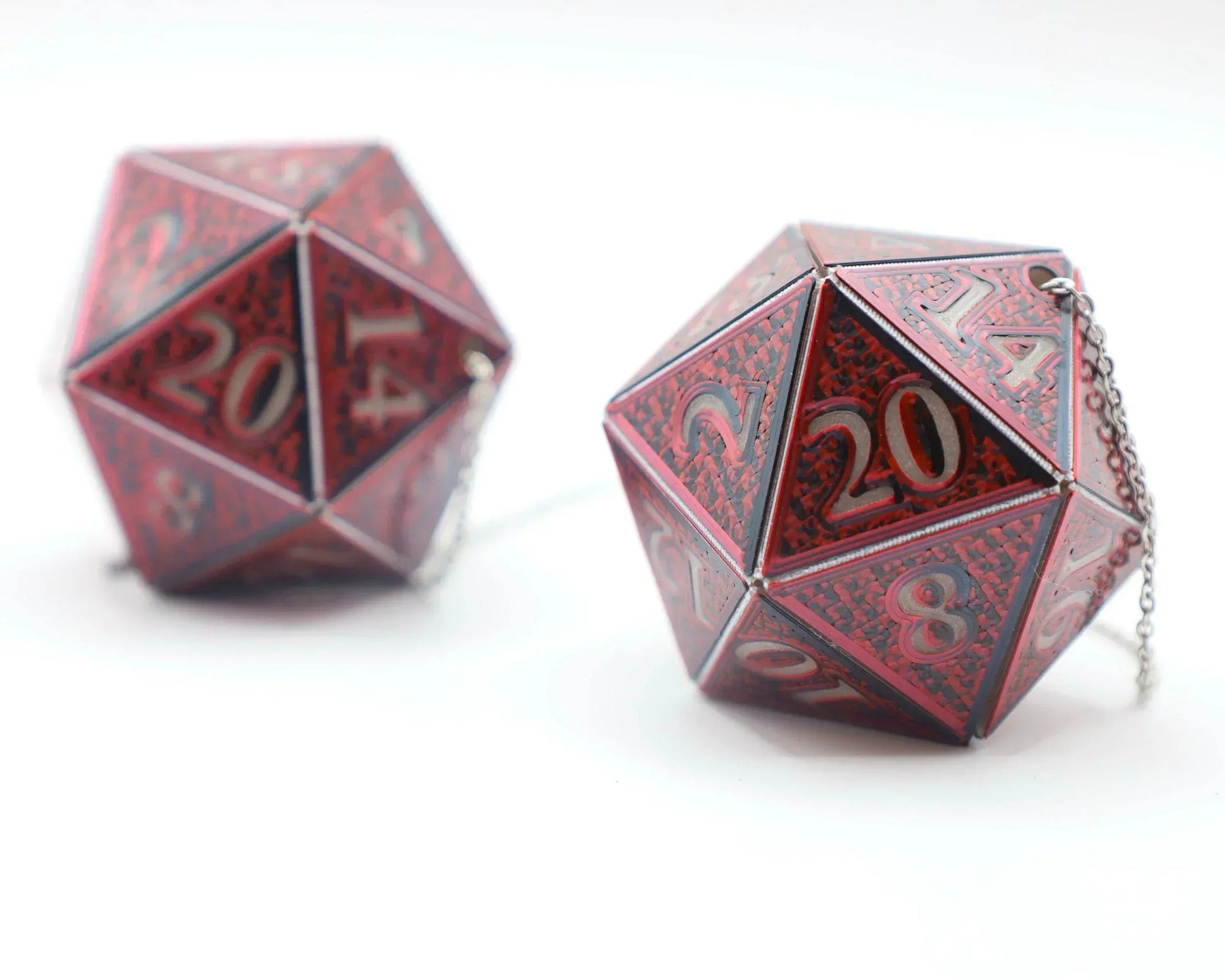 Red holographic twenty-sided dice with engraved numbers and silver chain for car charm.