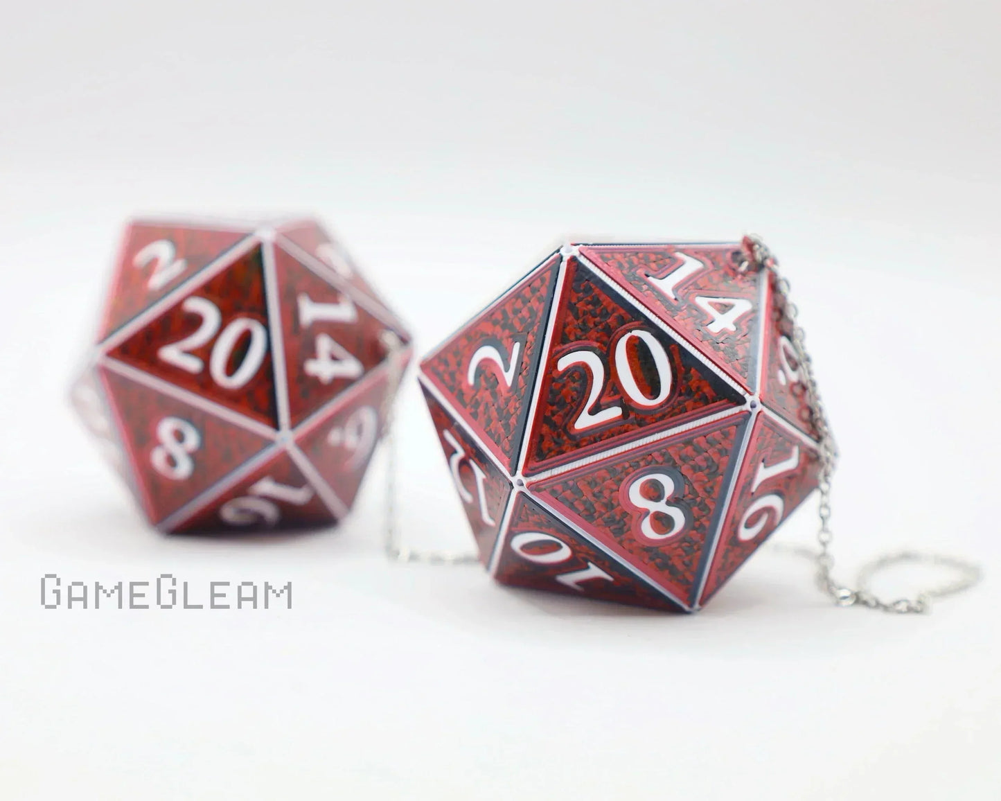 Red handmade twenty-sided dice with chain, gamer car accessory on white background