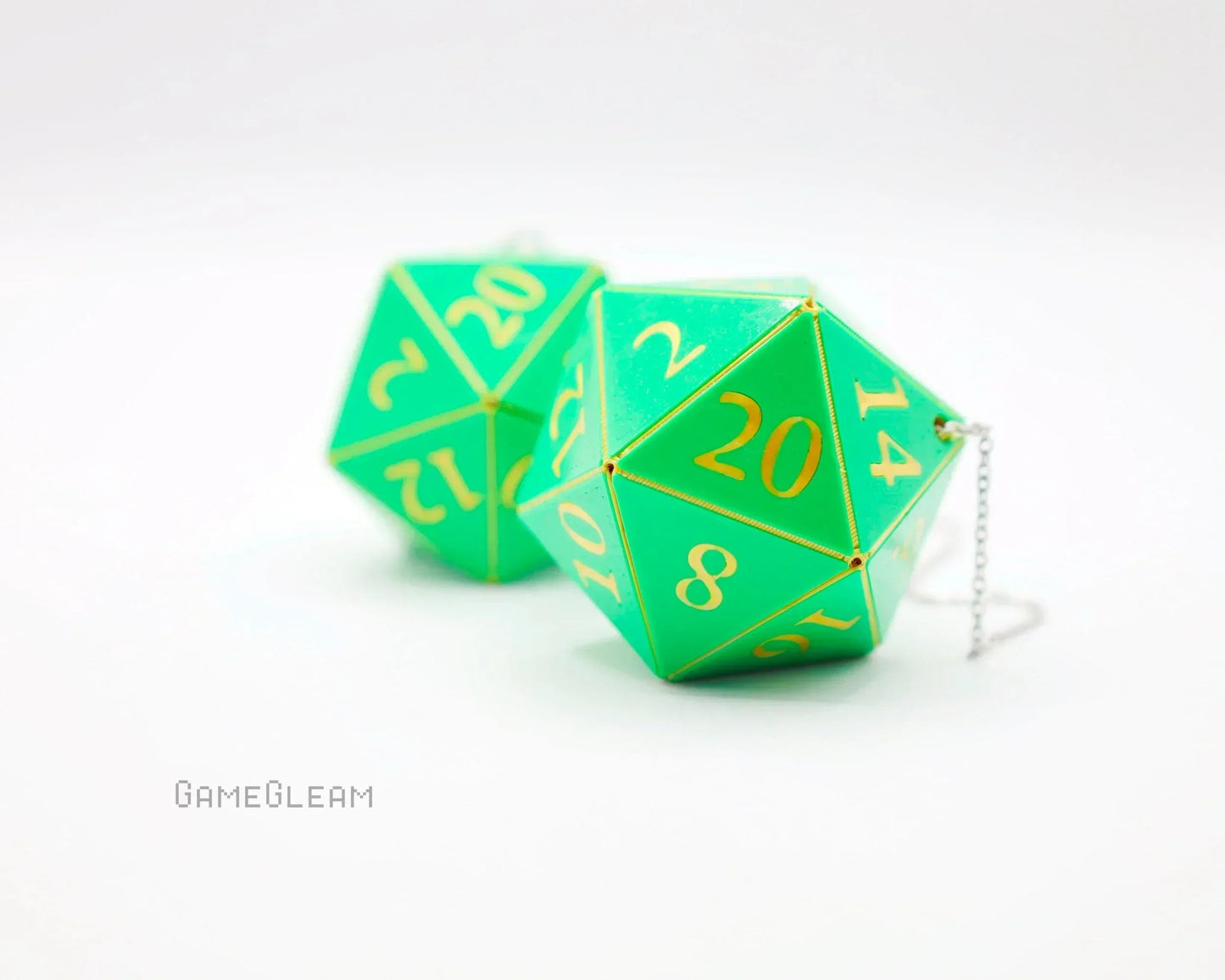 Green twenty-sided dice with gold numbers and chain, tabletop gamer car accessory
