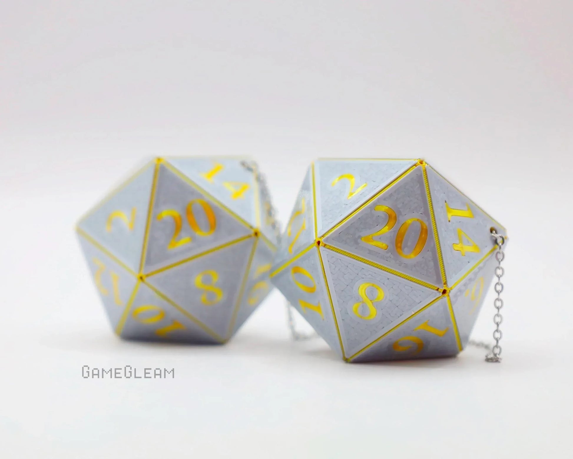 Handmade silver twenty-sided dice car charms with yellow numbers and attached chains