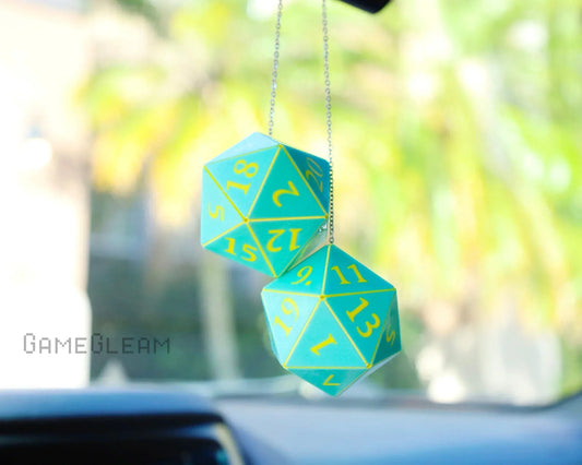 Holographic green and yellow twenty-sided dice car charm hanging from a rearview mirror.